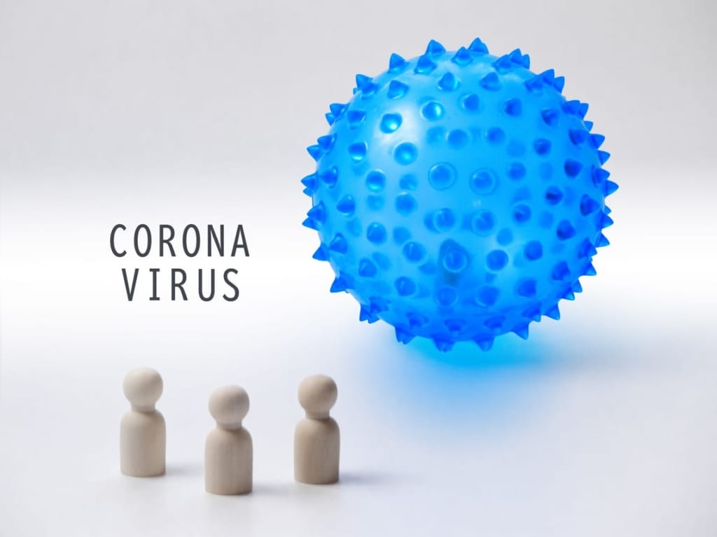 新型コロナウイルスのイメージと3体の人形